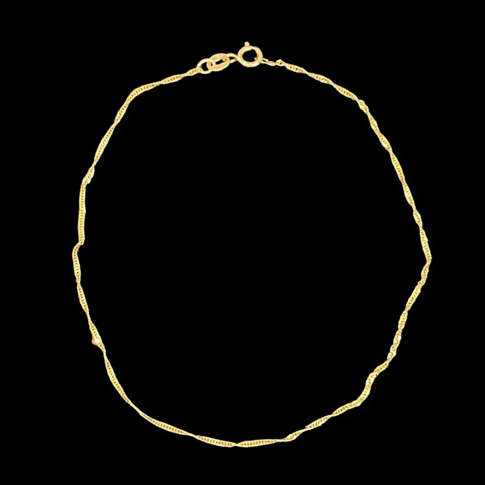 10KT Yellow Gold Delicate Twist Bracelet .4mm - 0.3g - 9” length